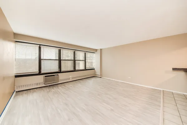 a view of an empty room with a window