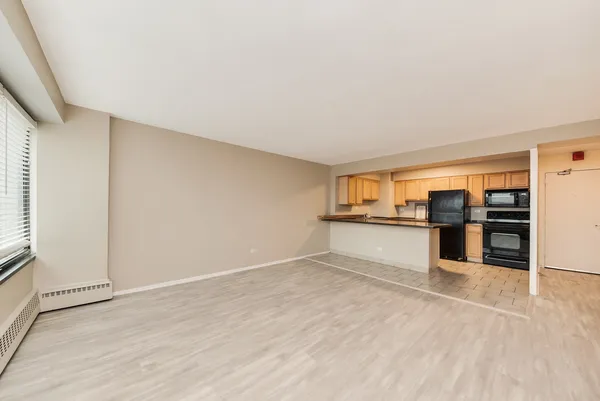 a view of a kitchen with wooden floor