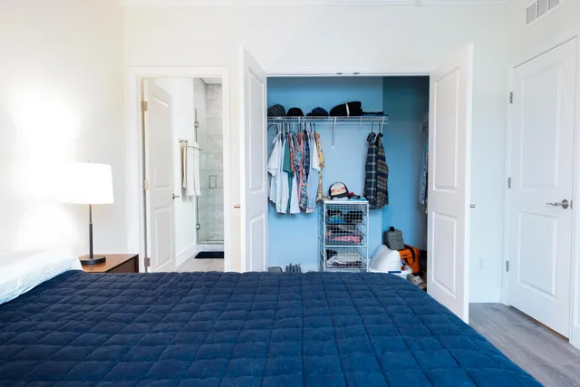 a bedroom with a bed and a view of bedroom