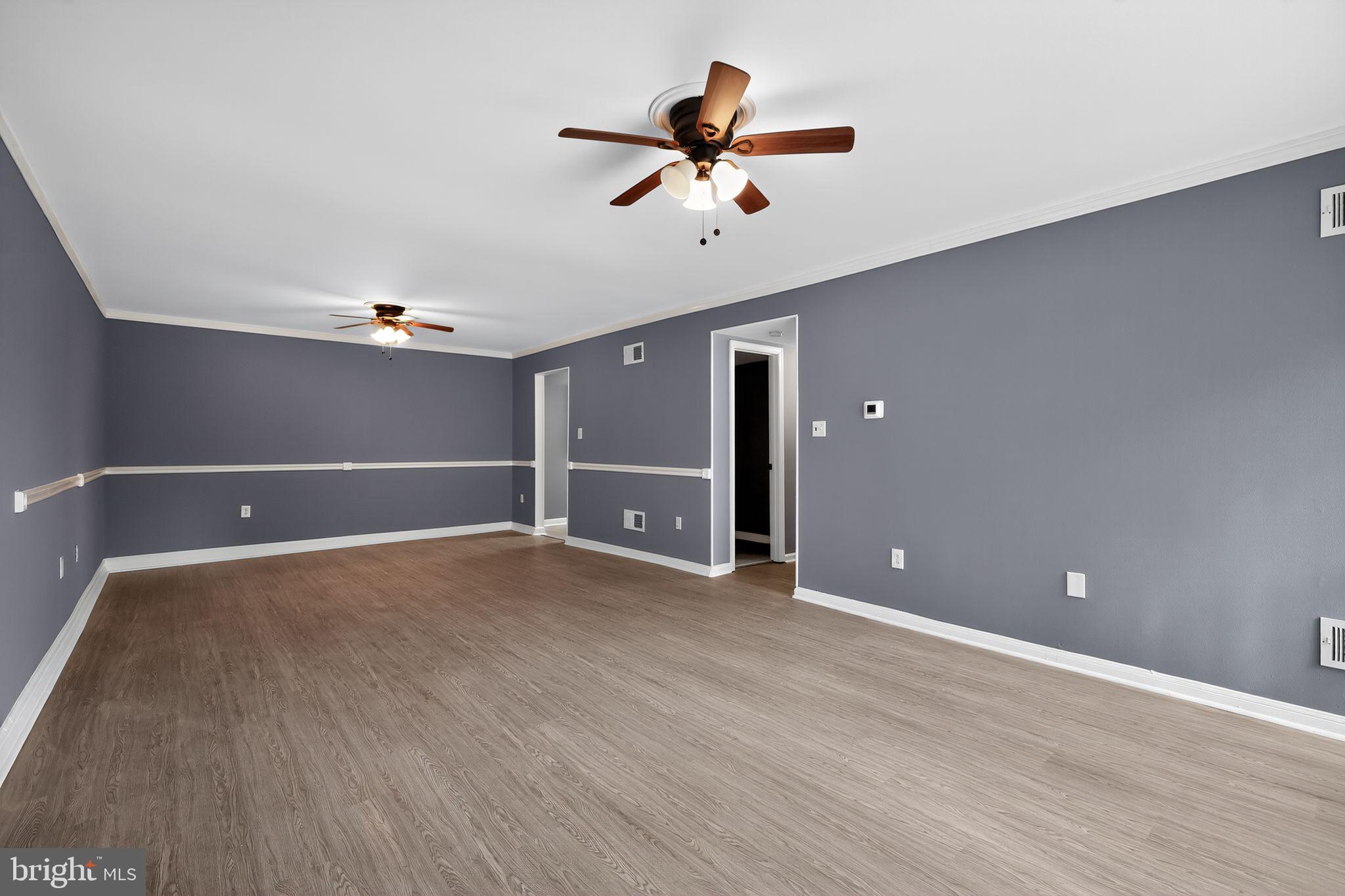 1621 Addison Road South District Heights, MD 20747 - Photo 12 of 15 a view of an empty room with a ceiling fan