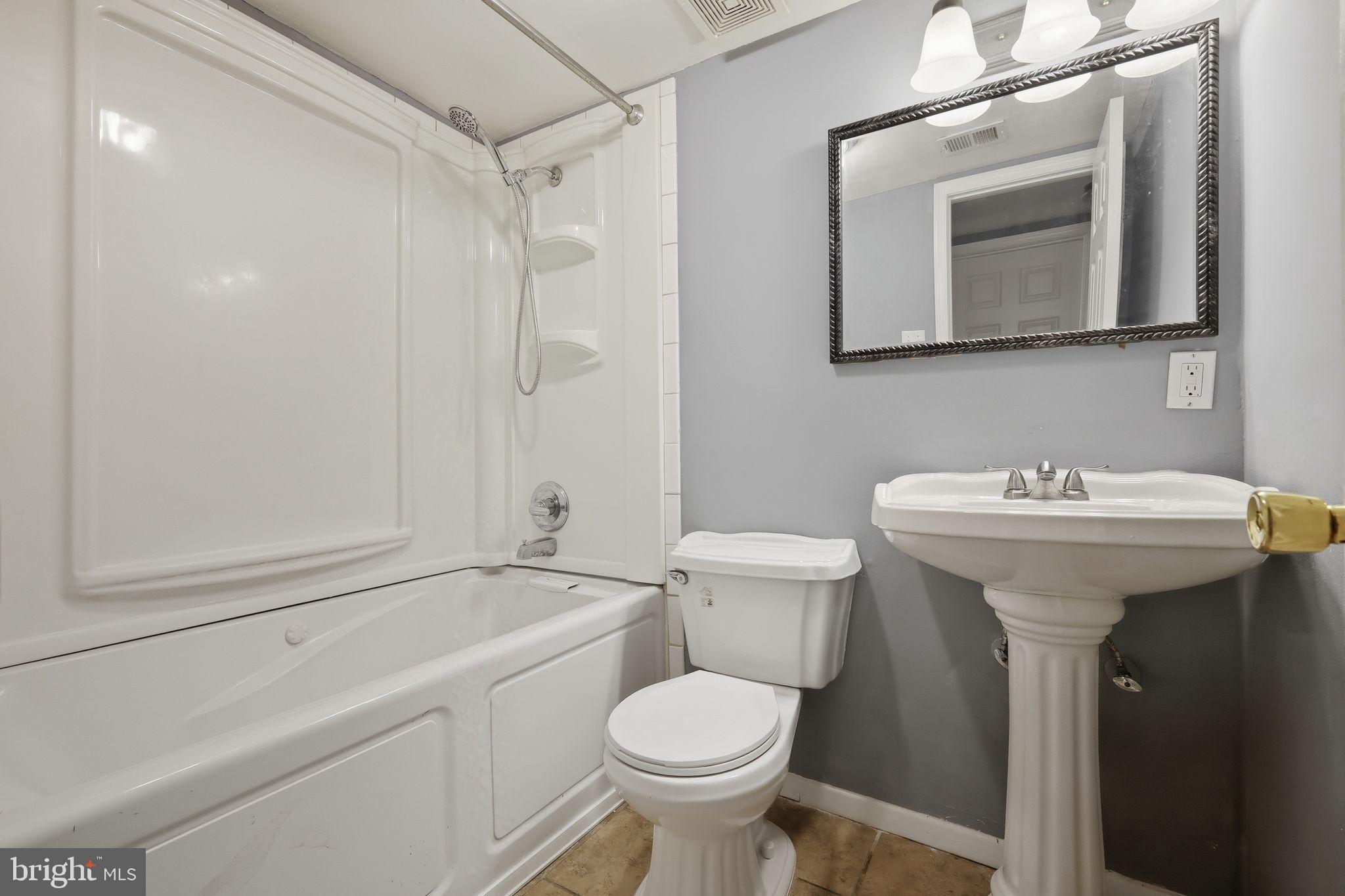 1621 Addison Road South District Heights, MD 20747 - Photo 15 of 15 a bathroom with a sink toilet and shower