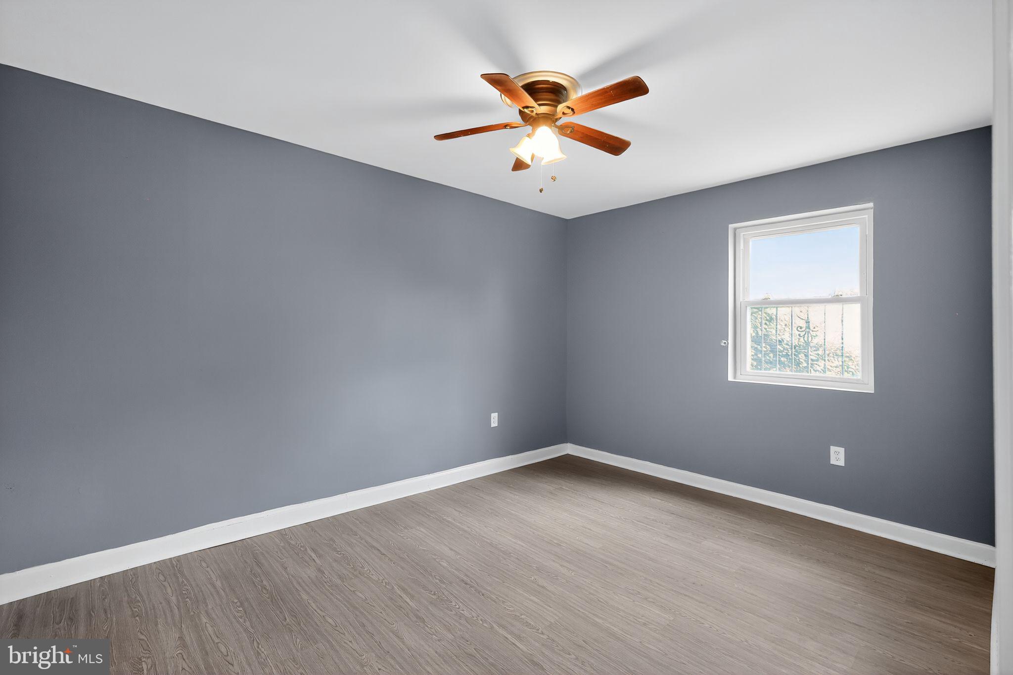 1621 Addison Road South District Heights, MD 20747 - Photo 5 of 15 an empty room with ceiling fan and window