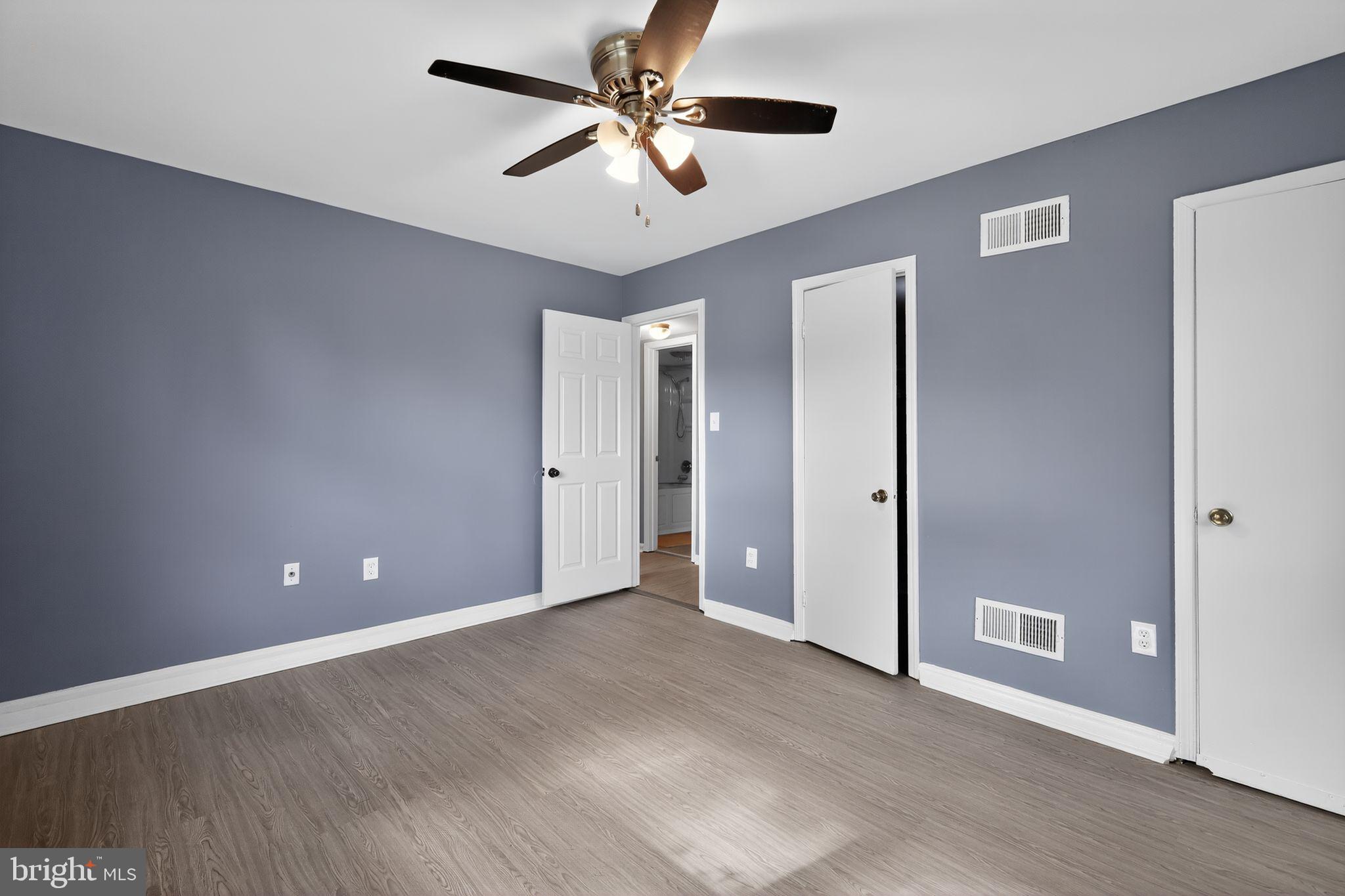 1621 Addison Road South District Heights, MD 20747 - Photo 8 of 15 a view of an empty room with a ceiling fan