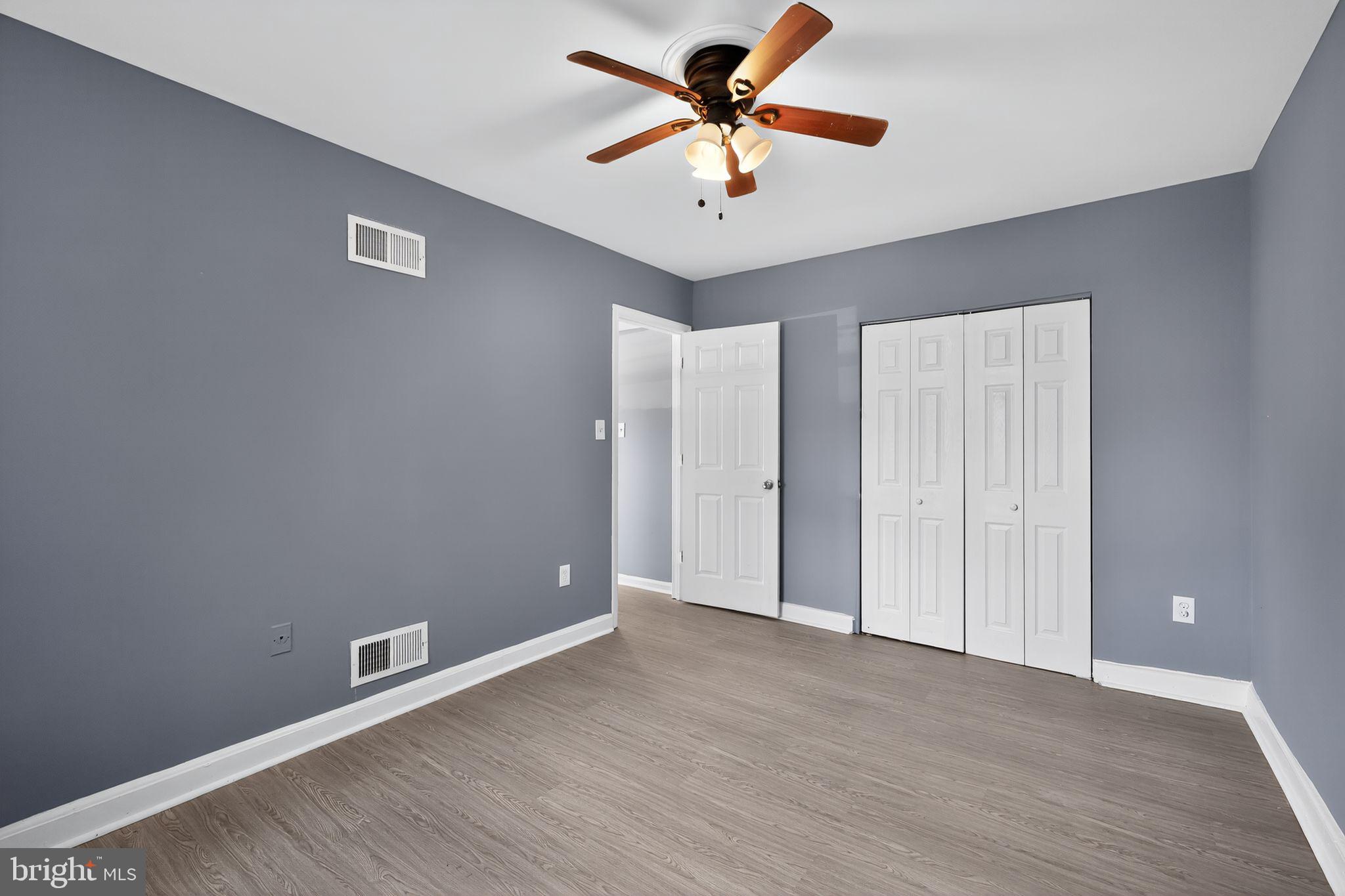 1621 Addison Road South District Heights, MD 20747 - Photo 10 of 15 wooden floor in an empty room