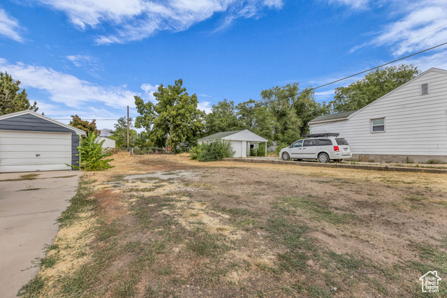 260 36th Street Ogden, UT 84401 - Photo 8 of 15 View of yard featuring an outdoor structure and a detached garage