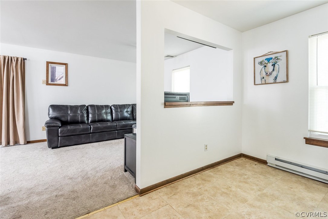 10331 Genlou Road Chesterfield, VA 23832 - Photo 15 of 25 a living room with a couch and a couch