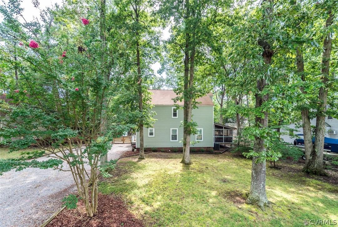 10331 Genlou Road Chesterfield, VA 23832 - Photo 2 of 25 a house is sitting in middle of forest