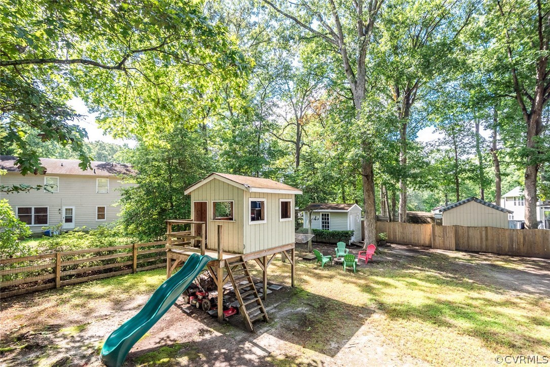 10331 Genlou Road Chesterfield, VA 23832 - Photo 23 of 25 a view of a house with backyard and sitting area
