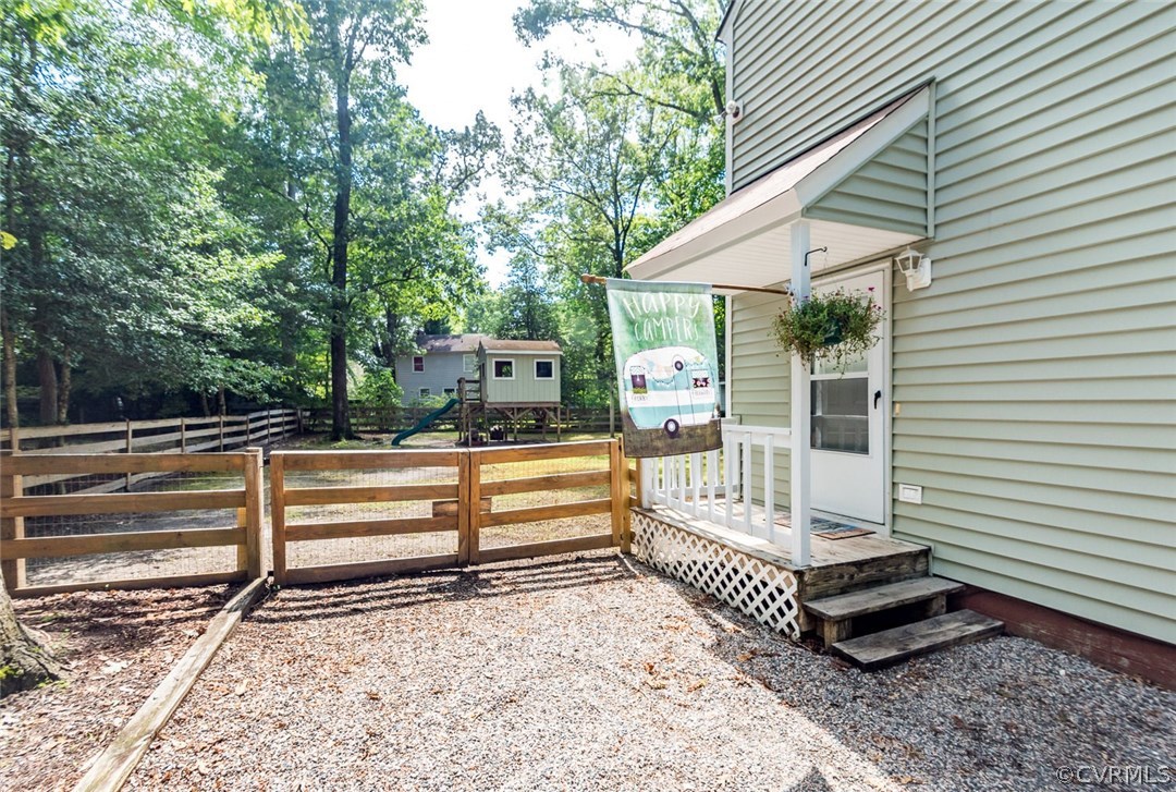 10331 Genlou Road Chesterfield, VA 23832 - Photo 3 of 25 a view of backyard with deck and outdoor seating