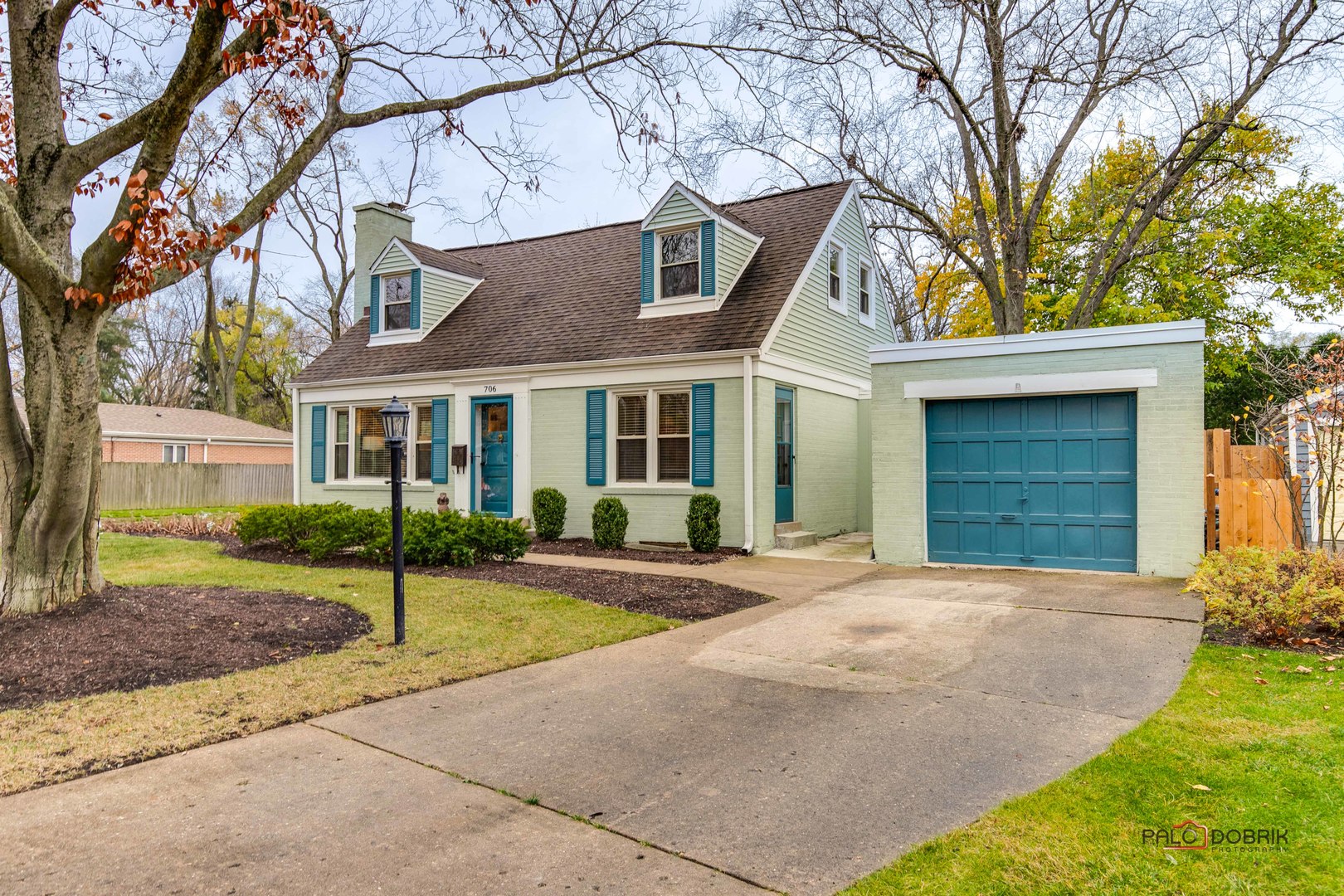 706 Deerpath Drive Deerfield, IL 60015 - Photo 1 of 36 a front view of a house with a yard and garage