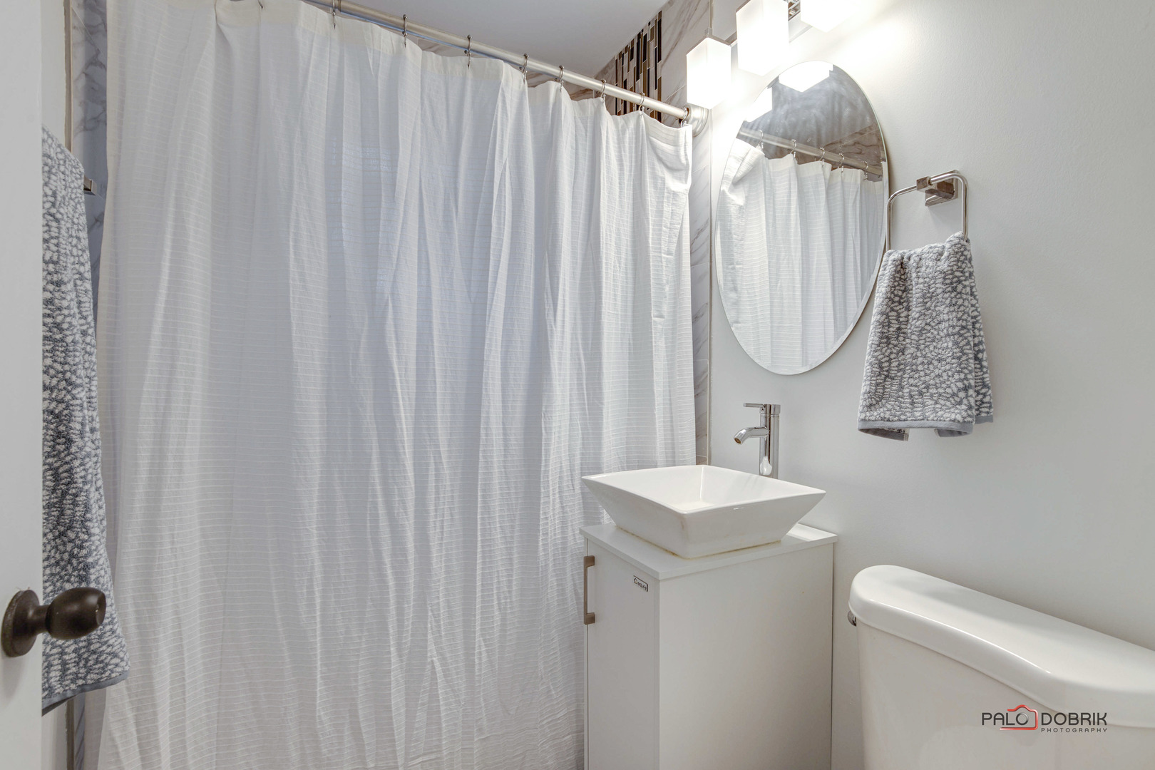 706 Deerpath Drive Deerfield, IL 60015 - Photo 13 of 36 a bathroom with a sink a toilet and shower