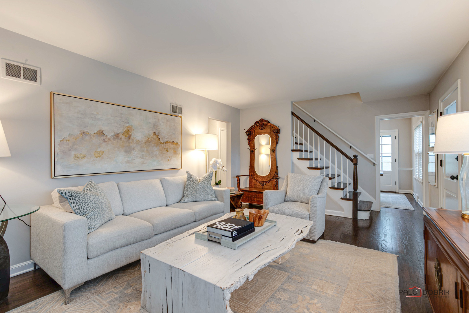 706 Deerpath Drive Deerfield, IL 60015 - Photo 4 of 36 a living room with furniture and a large mirror next to a window