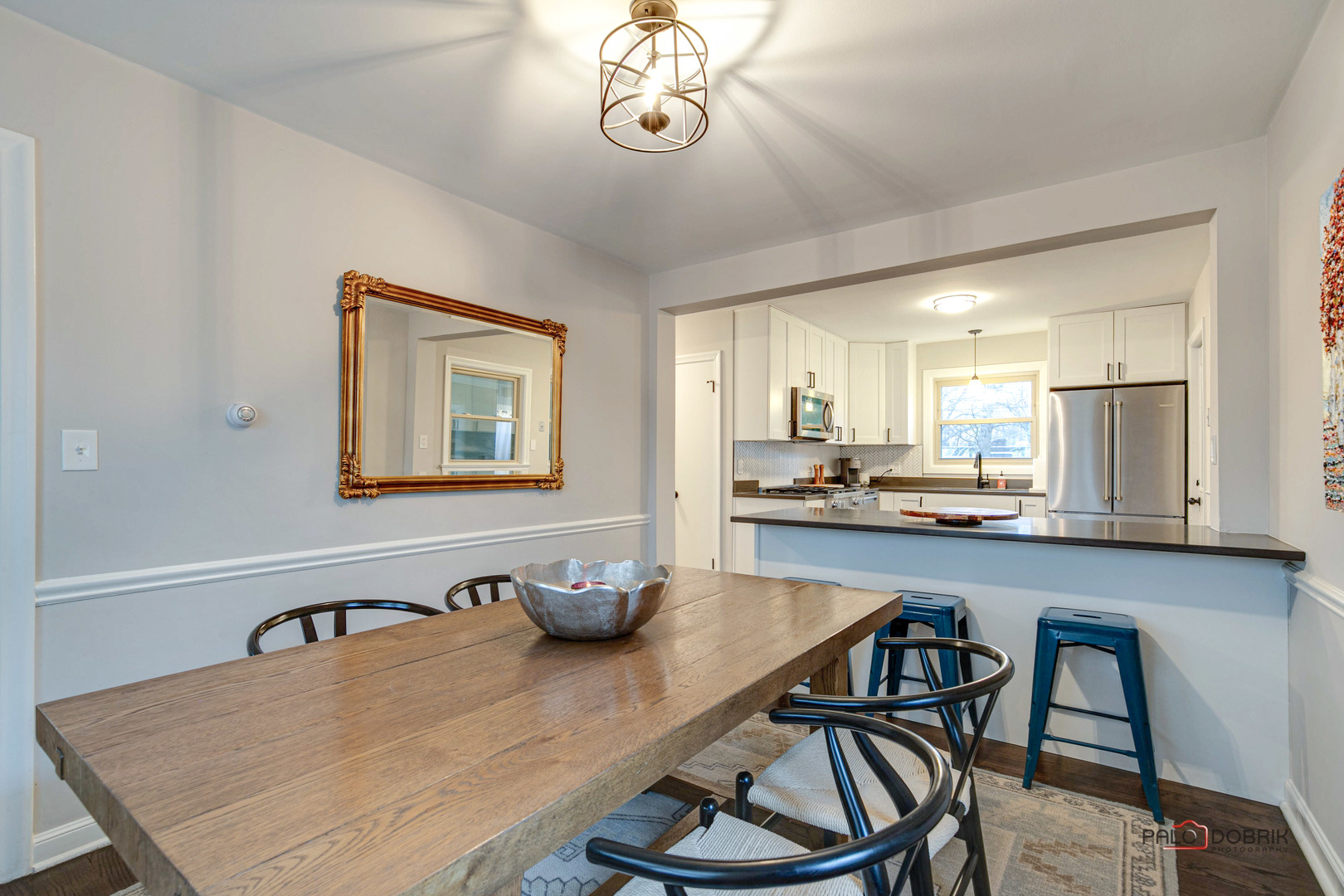 706 Deerpath Drive Deerfield, IL 60015 - Photo 8 of 36 a kitchen with a table chairs stove and cabinets