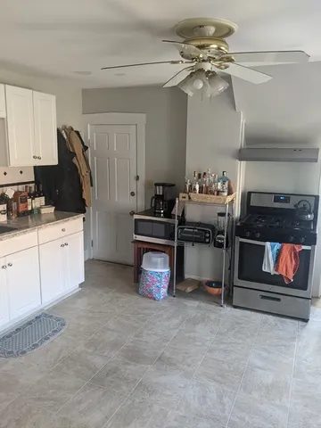 a kitchen with cabinets and appliances