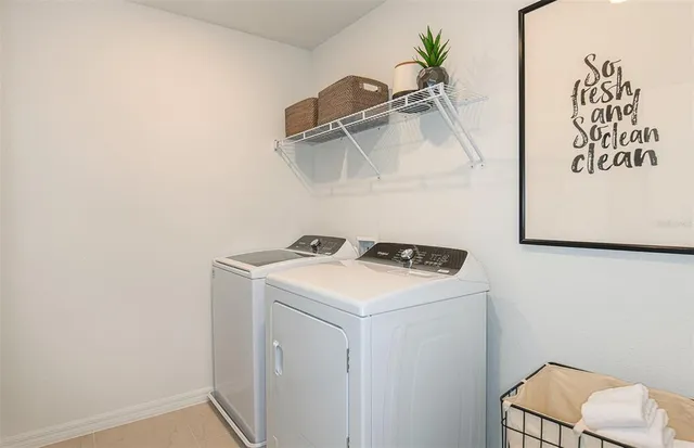 a utility room with dryer and washer