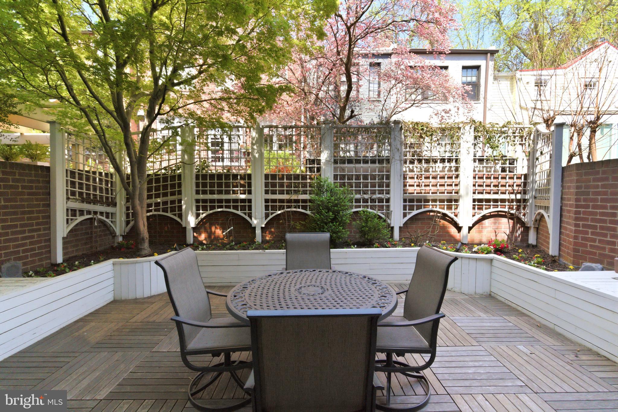 1215 28th Street Northwest, Unit L4 Washington, DC 20007 - Photo 8 of 48 a view of a table and chairs in the patio