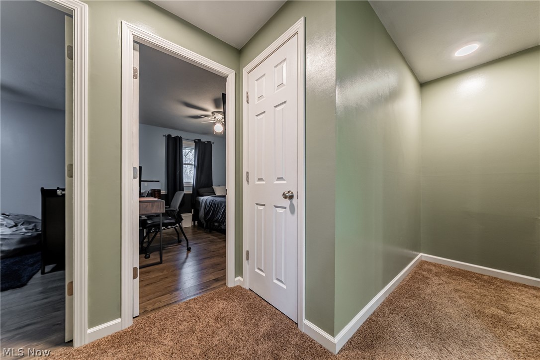 7791 Ridge Road Parma, OH 44129 - Photo 17 of 41 Hallway featuring dark carpet