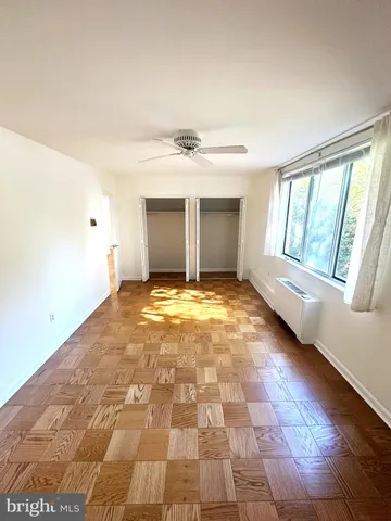 a view of an empty room with a window