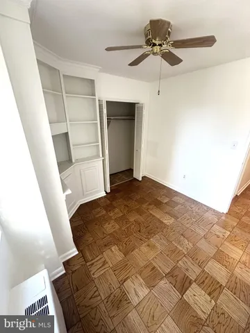 a view of a livingroom with a ceiling fan and a rug