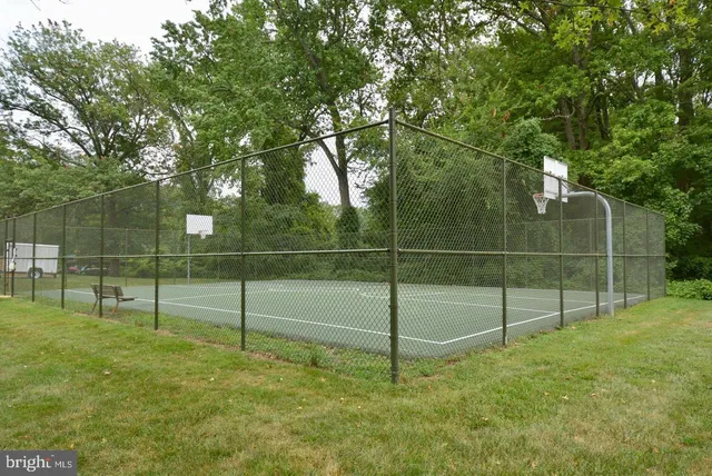 a view of a backyard with floor to ceiling window