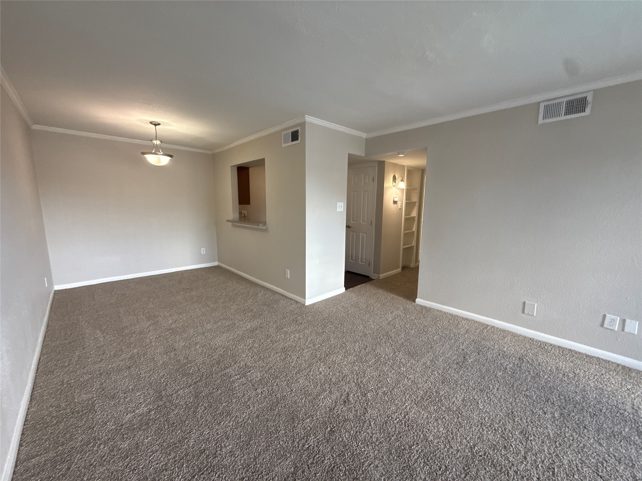 7315 Brompton Road, Unit 315B Houston, TX 77025 - Photo 3 of 13 a view of an empty room and a ceiling fan
