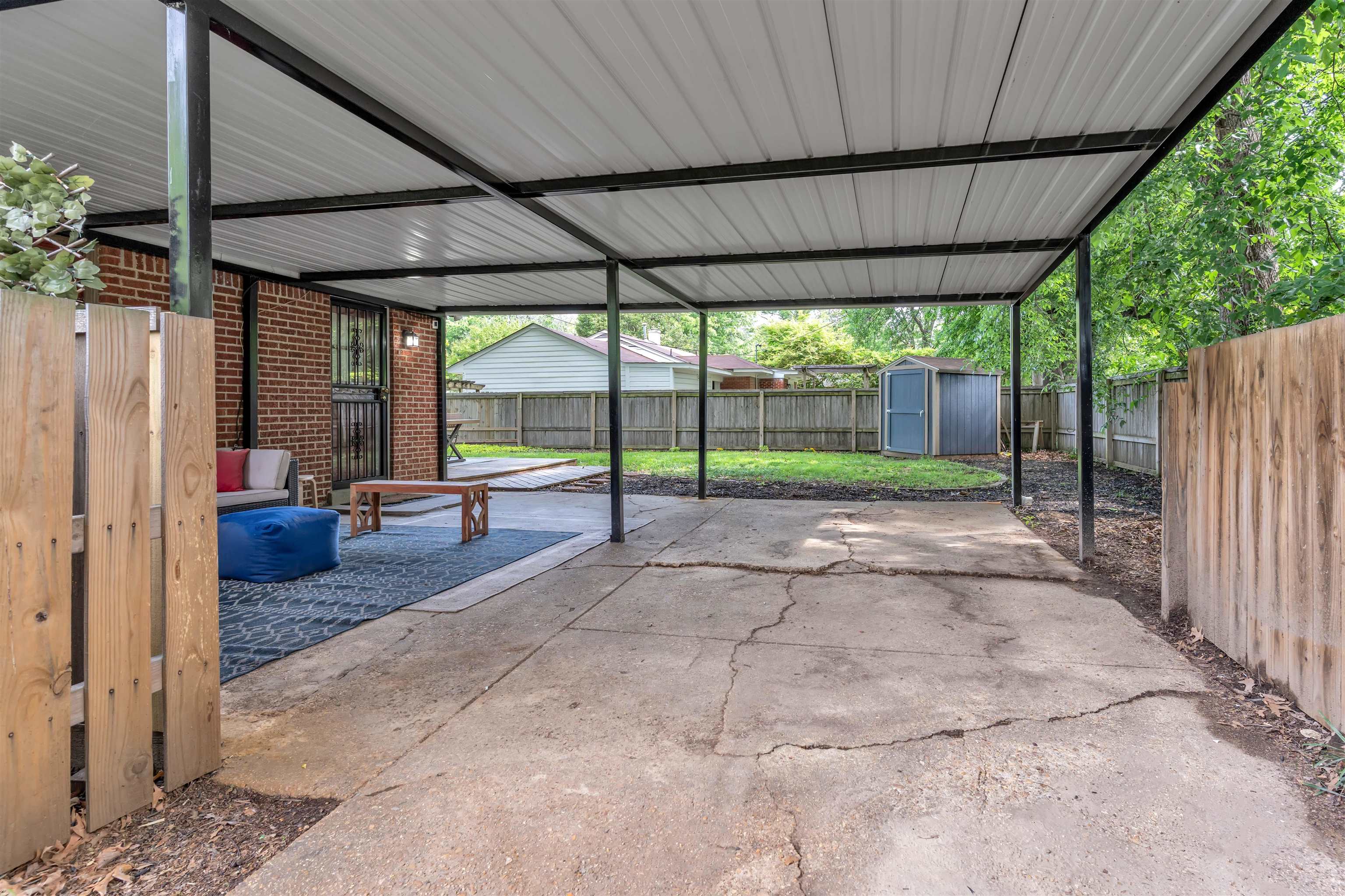 4564 Verne Road Memphis, TN 38117 - Photo 16 of 25 Covered patio area featuring a concrete surface and direct access to the brick-clad exterior