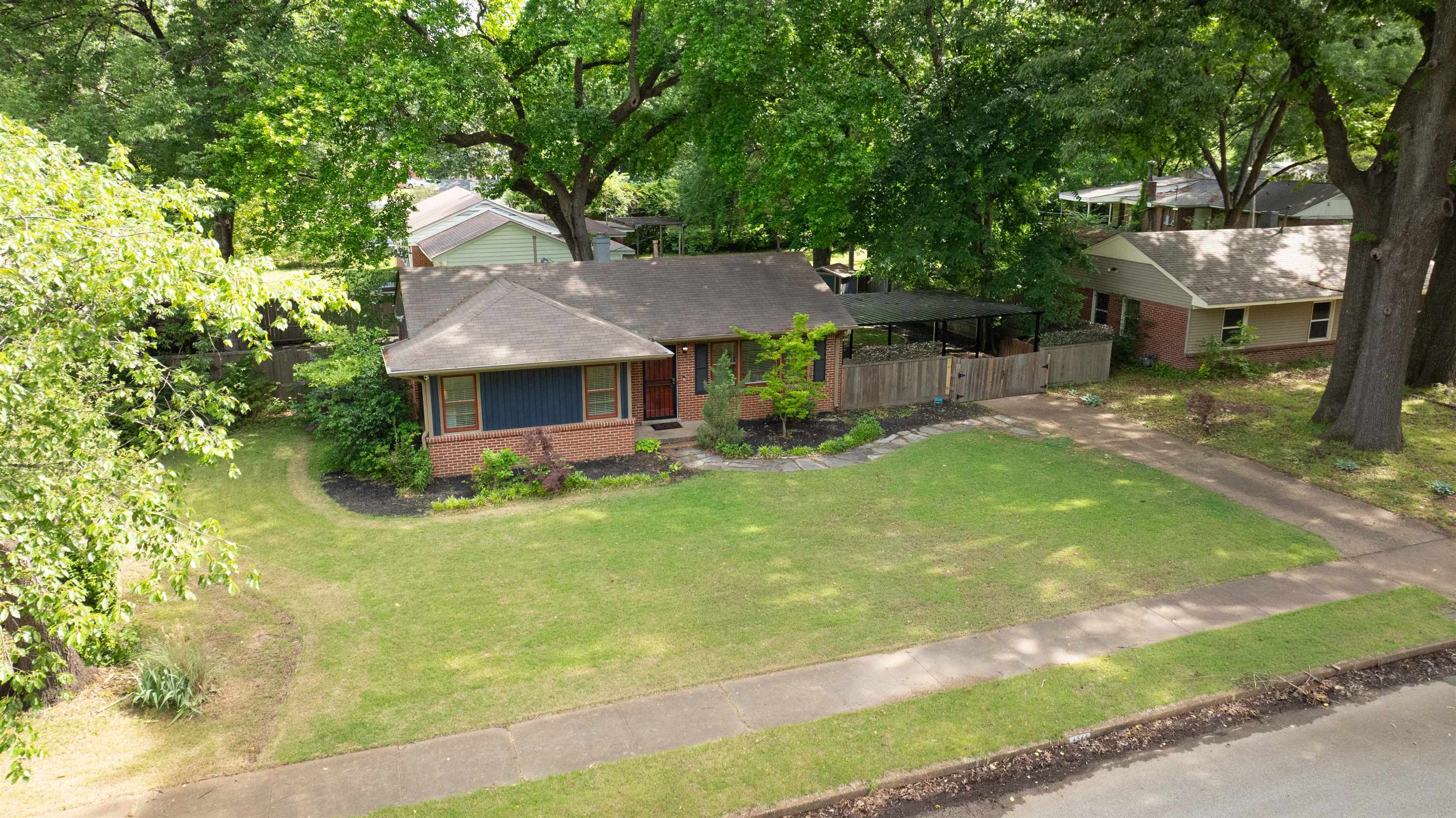 4564 Verne Road Memphis, TN 38117 - Photo 23 of 25 Brick exterior residence with a covered front porch and mature trees