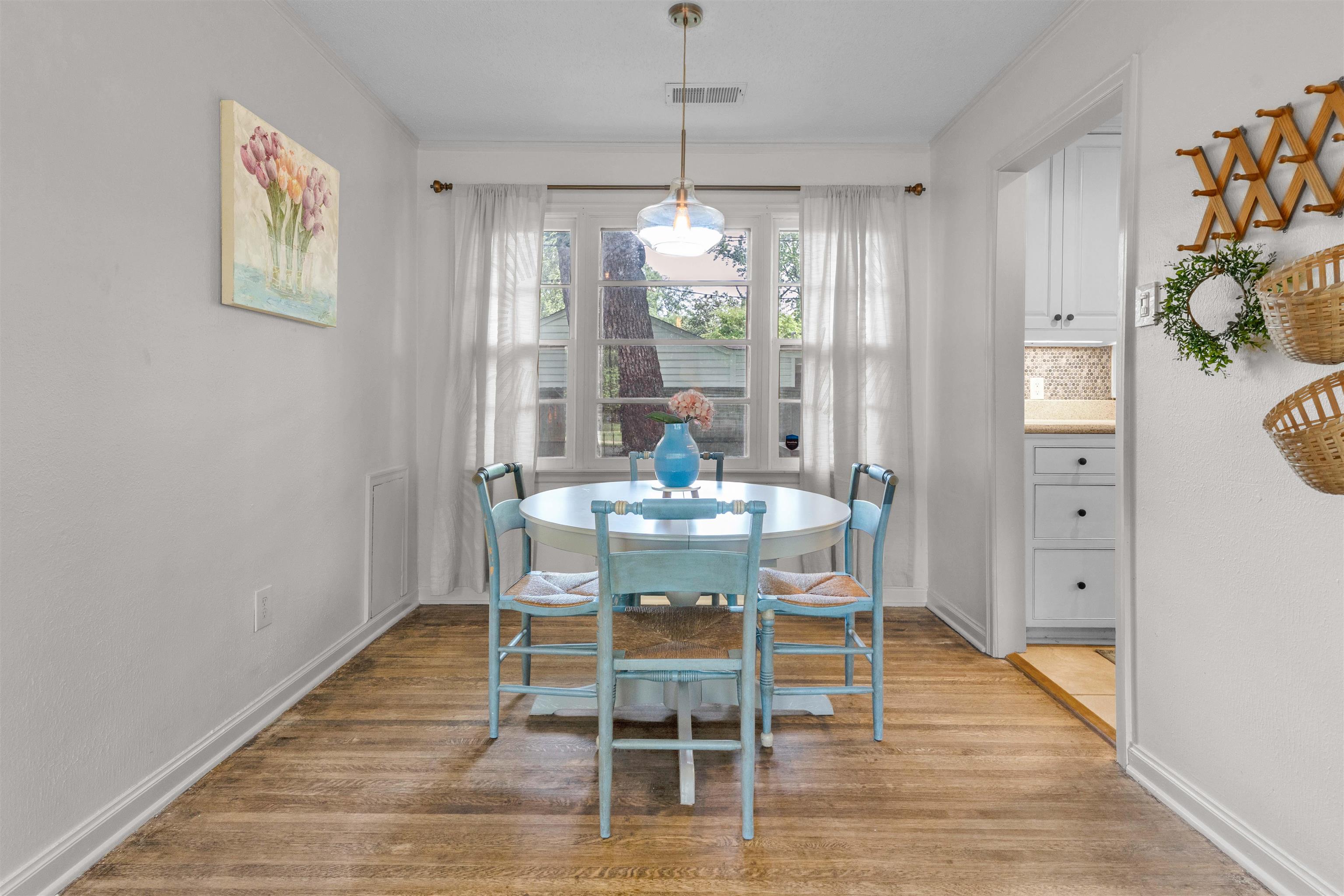 4564 Verne Road Memphis, TN 38117 - Photo 7 of 25 Dining area featuring wood-finish flooring, white baseboards, and a window with natural light