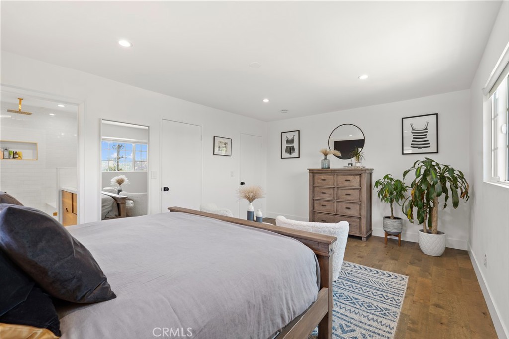 2425 Arthur Street Los Angeles, CA 90065 - Photo 14 of 29 a bedroom with a bed and a chandelier