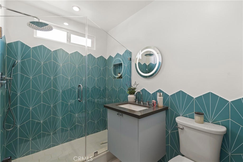 2425 Arthur Street Los Angeles, CA 90065 - Photo 18 of 29 a bathroom with a toilet a sink and a shower curtain