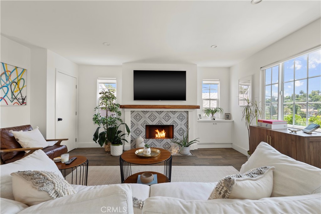 2425 Arthur Street Los Angeles, CA 90065 - Photo 3 of 29 a living room with furniture a fireplace and a flat screen tv