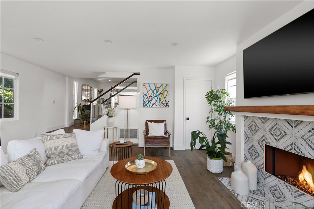 2425 Arthur Street Los Angeles, CA 90065 - Photo 4 of 29 a living room with furniture a fireplace and a flat screen tv