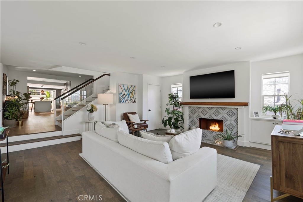 2425 Arthur Street Los Angeles, CA 90065 - Photo 5 of 29 a living room with furniture a flat screen tv and a fireplace
