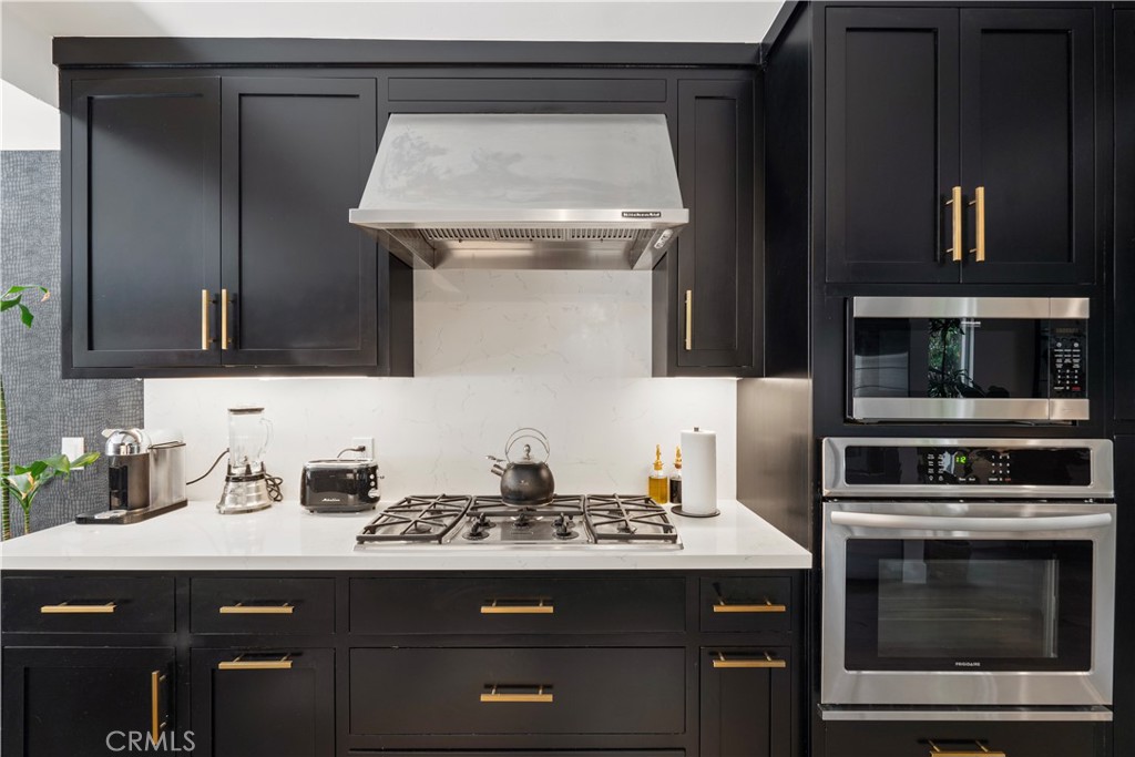 2425 Arthur Street Los Angeles, CA 90065 - Photo 7 of 29 a kitchen with a stove and a microwave