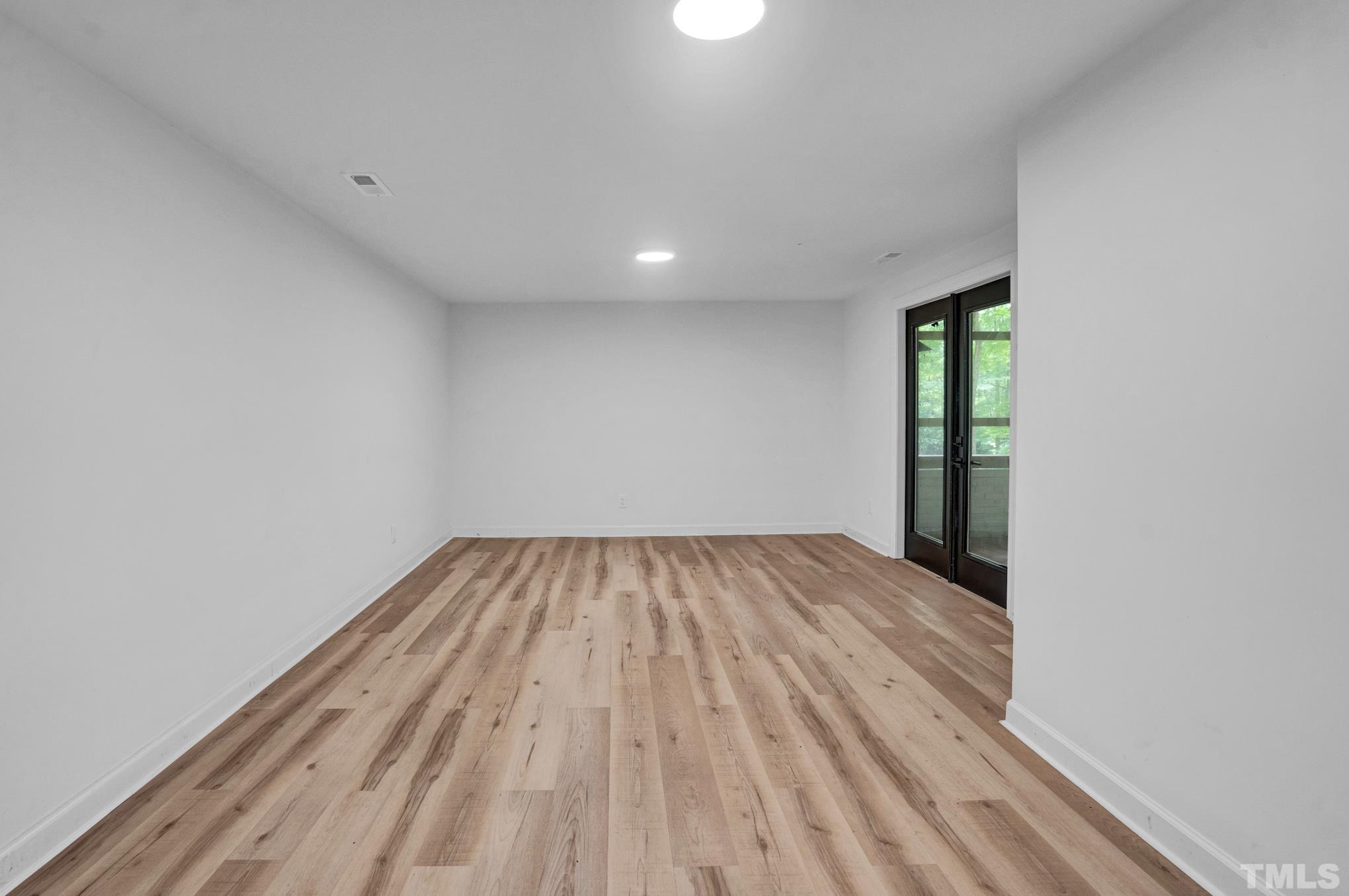 12600 Old Creedmoor Road Raleigh, NC 27613 - Photo 11 of 24 a view of empty room with wooden floor