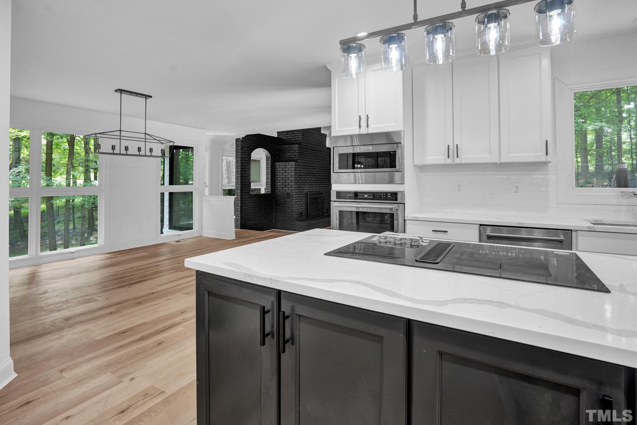 12600 Old Creedmoor Road Raleigh, NC 27613 - Photo 16 of 24 a kitchen with a sink a stove and cabinets