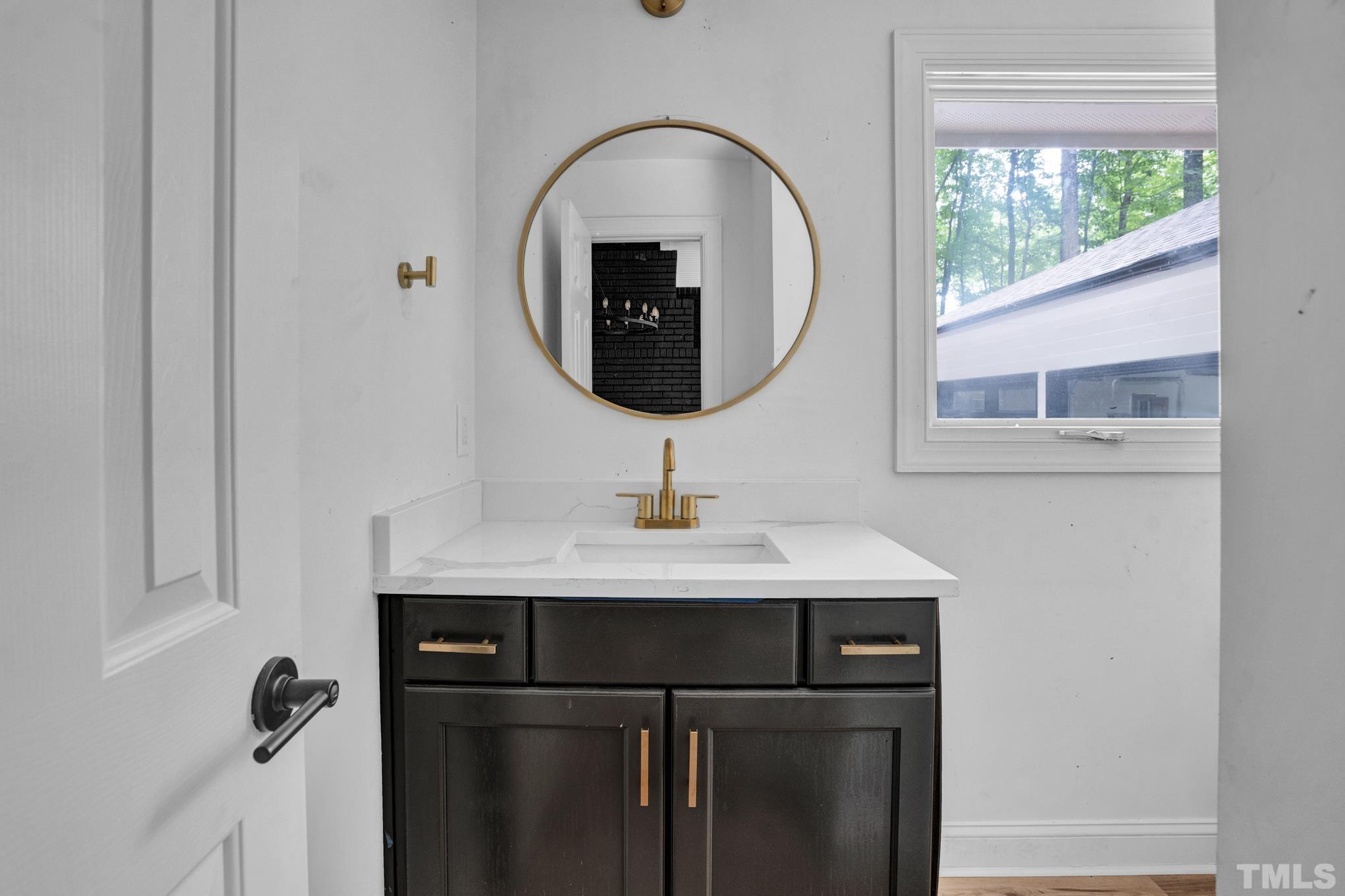 12600 Old Creedmoor Road Raleigh, NC 27613 - Photo 2 of 24 a bathroom with a sink and a mirror