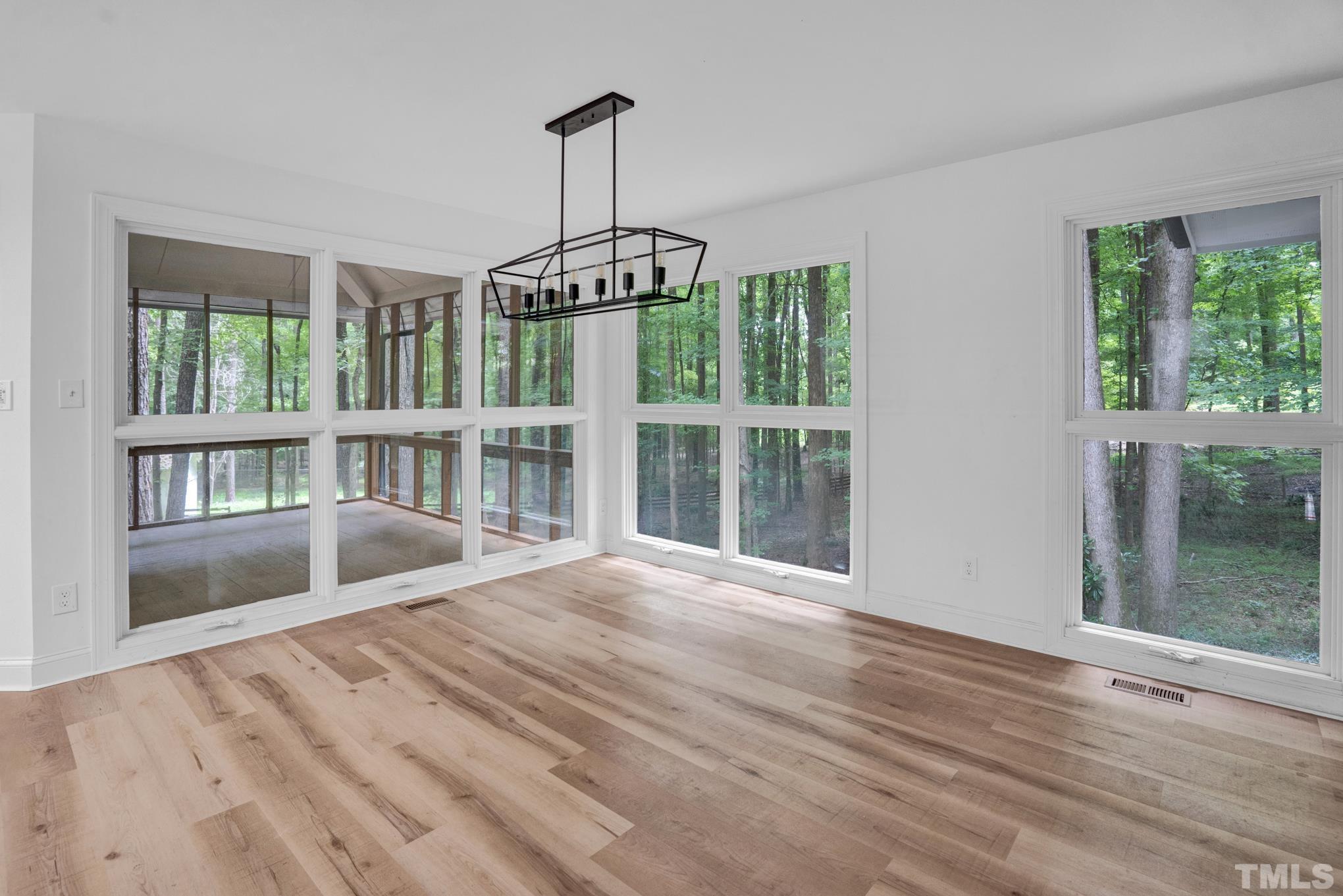 12600 Old Creedmoor Road Raleigh, NC 27613 - Photo 5 of 24 a view of an empty room with a window