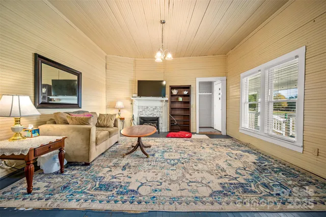 a living room with furniture windows and a fireplace