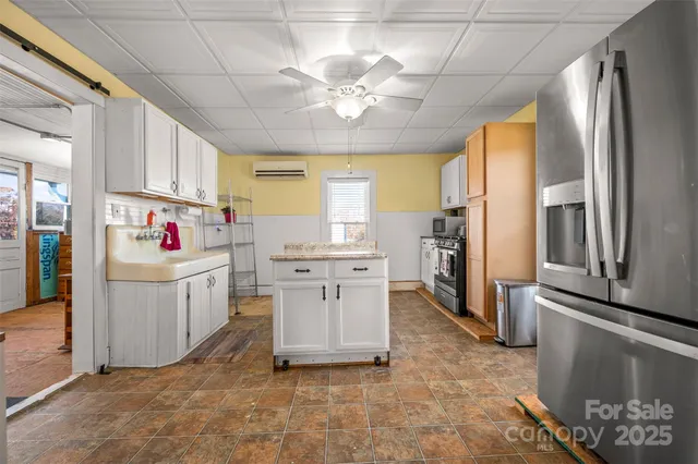 a kitchen with cabinets a sink and appliances