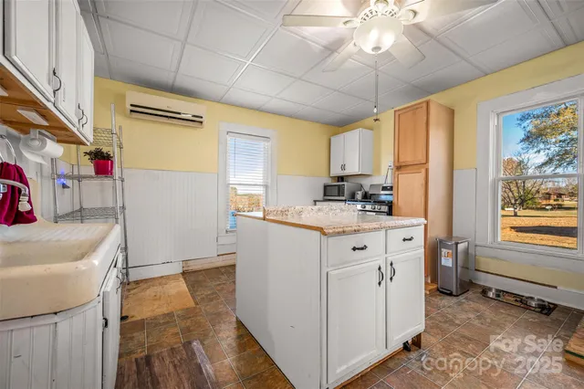 a kitchen with stainless steel appliances a stove and a refrigerator