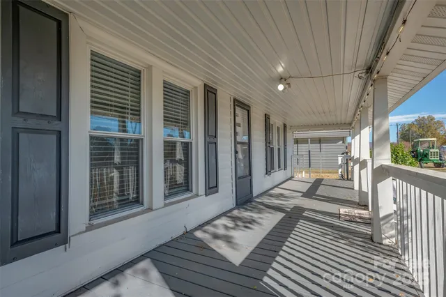 a view of a balcony with wooden floor