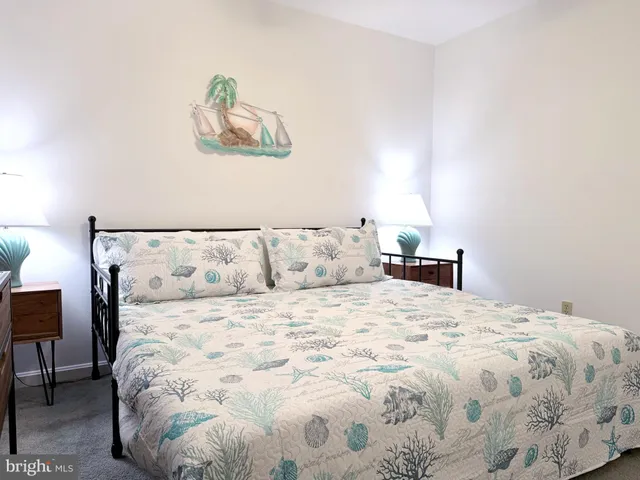 a large white bed in a white room