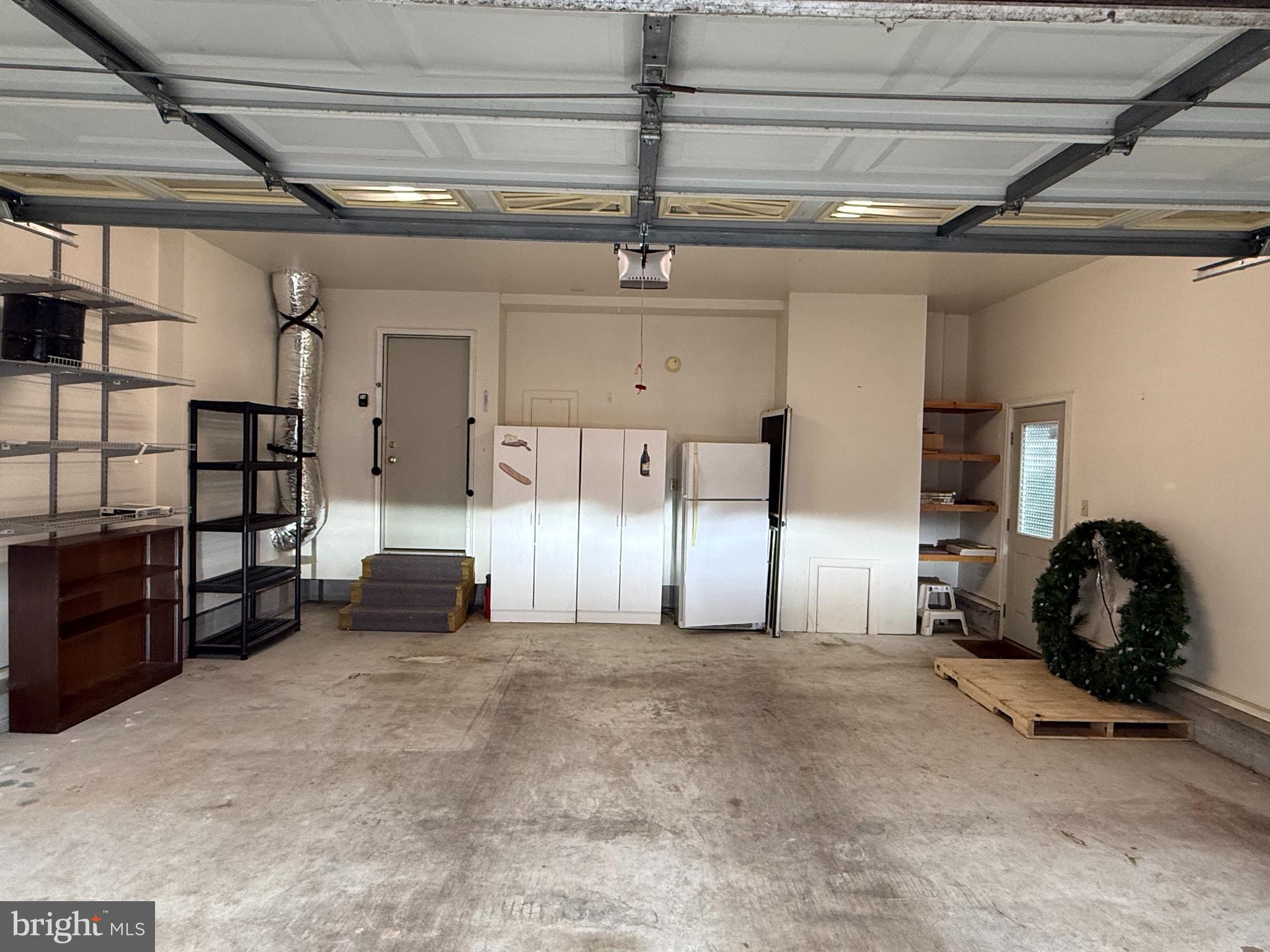 4 Fantail Court Ocean Pines, MD 21811 - Photo 30 of 33 Garage with shelving and extra fridge