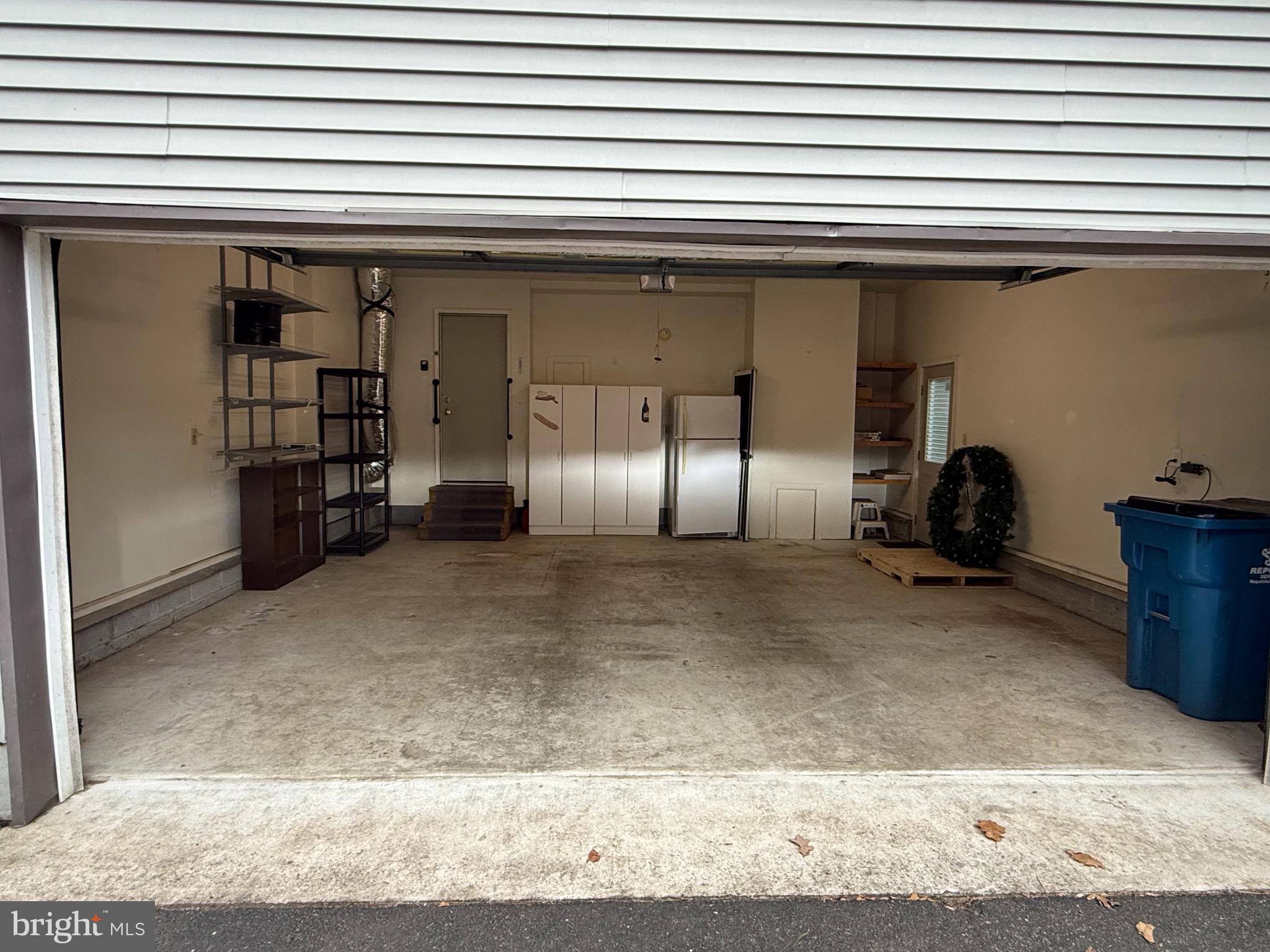 4 Fantail Court Ocean Pines, MD 21811 - Photo 32 of 33 Garage with cabinets and extra refridgerater