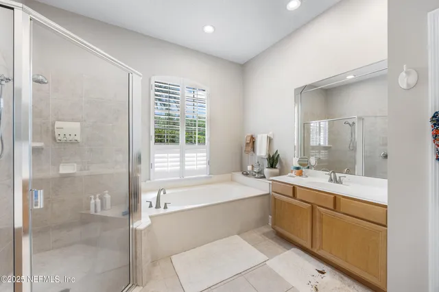 a dining room with furniture and a floor to ceiling window