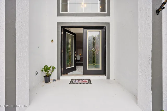 a living room with furniture or wooden floor and a chandelier
