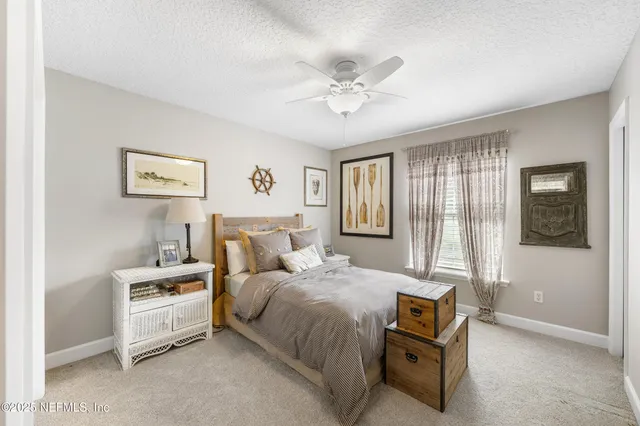 an aerial view of a house with garden space and street view