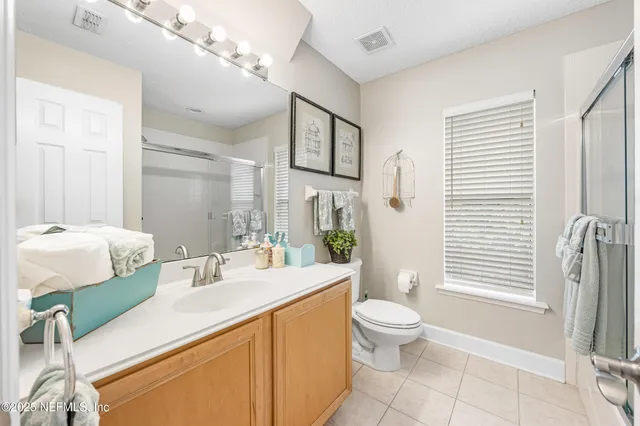 an aerial view of a house with yard swimming pool and outdoor seating