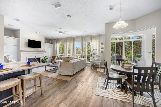 a large kitchen with stainless steel appliances granite countertop a lot of counter space and wooden floor